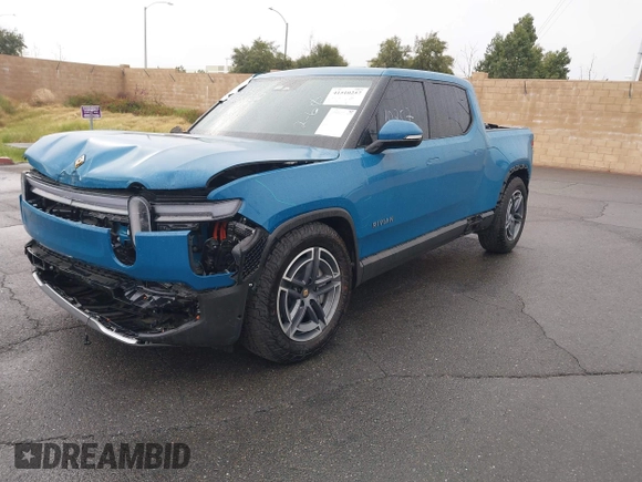 2025 Rivian R1T Adventure z VIN 7FCTGBAA9SN035986, wystawiony jako IAAI lot #41510257 z przebiegiem 2 102 mil mil oraz . Historia ofert i sprzedaży dostępna na DreamBid. Obrazek 2.