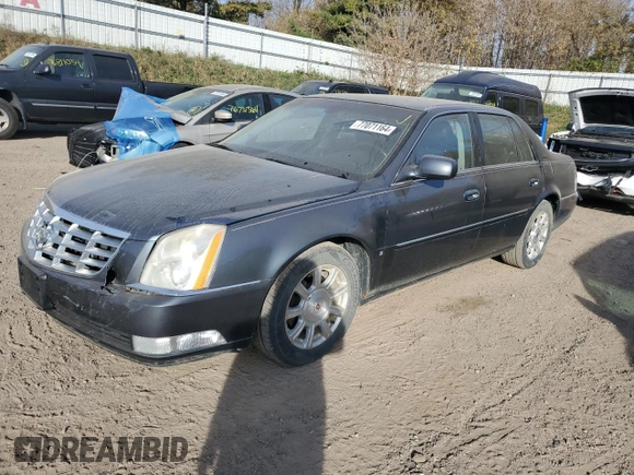 2009 Cadillac DTS 1SC z VIN 1G6KD57Y39U129722, wystawiony jako Copart lot #77071164 z przebiegiem 133 769 mil mil oraz Czysty tytuł • Clean title. Historia ofert i sprzedaży dostępna na DreamBid. Obrazek 1.