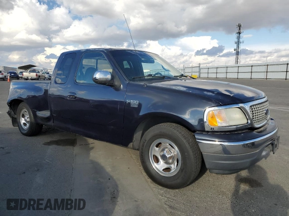 2000 Ford F-150 with VIN 1FTRX07W3YKA56561, listed as a Copart auction lot 81149654 with 185,967 mi miles and Salvage title. Bid and sale history available at DreamBid. Image 4.