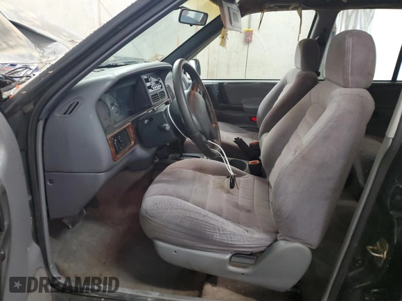 1996 Jeep Grand Cherokee Laredo with VIN 1J4GZ58S0TC402024, listed as a Copart auction lot 65074774 with 163,477 mi miles and Salvage Title. Bid and sale history available at carsss.com. Image 7.