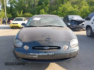 1999 Ford Taurus SE Comfort z VIN 1FAFP53S3XG104165, wystawiony jako IAAI lot #42234147 z przebiegiem 183 124 mil mil oraz . Historia ofert i sprzedaży dostępna na DreamBid. Obrazek 6.