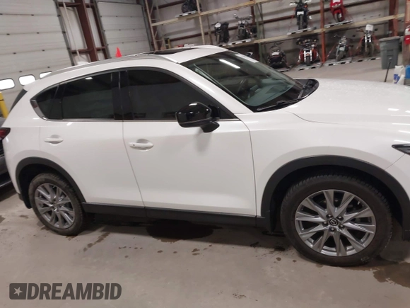 2020 Mazda CX-5 Grand Touring with VIN JM3KFBDM6L1828611, listed as a IAAI auction lot 42006976 with 59,939 mi miles and . Bid and sale history available at DreamBid. Image 14.
