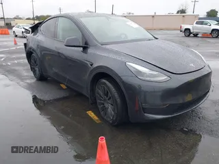 2024 Tesla Model Y Long Range with VIN 7SAYGDEE5RA241433, listed as a IAAI auction lot 41569277 with 7,490 mi miles. Bid and sale history available at carsss.com. Image 1.