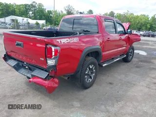 2021 Toyota Tacoma SR z VIN 5TFCZ5AN2MX263159, wystawiony jako IAAI lot #42273087 z przebiegiem 69 220 mil mil oraz . Historia ofert i sprzedaży dostępna na DreamBid. Obrazek 4.
