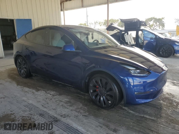 2023 Tesla Model Y Performance with VIN 7SAYGDEF1PF865688, listed as a Copart auction lot 44924385 with 19,255 mi miles and Non Repairable. Bid and sale history available at DreamBid. Image 4.