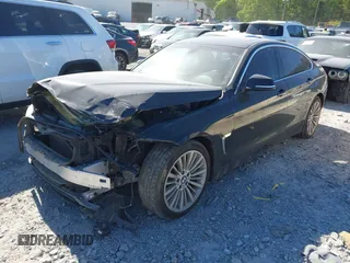 2015 BMW 4 Series 428i with VIN WBA4A5C51FG051393, listed as a IAAI auction lot 42041960 with 136,929 mi miles and . Bid and sale history available at carsss.com. Image 2.