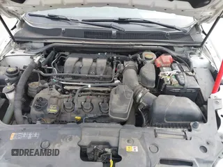2013 Ford Taurus SEL with VIN 1FAHP2E87DG111530, listed as a IAAI auction lot 41322957 with 183,103 mi miles. Bid and sale history available at carsss.com. Image 10.