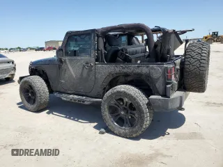 2015 Jeep Wrangler Sport with VIN 1C4GJWAG8FL563198, listed as a Copart auction lot 52867385 with 47,854 mi miles and Salvage title. Bid and sale history available at DreamBid. Image 2.