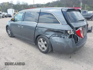 2012 Honda Odyssey Touring with VIN 5FNRL5H90CB045430, listed as a IAAI auction lot 42079770 with 113,901 mi miles and . Bid and sale history available at DreamBid. Image 3.