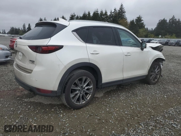 2021 Mazda CX-5 Signature with VIN JM3KFBEY3M0410998, listed as a Copart auction lot 54868885 with 73,207 mi miles and Salvage Title. Bid and sale history available at carsss.com. Image 3.