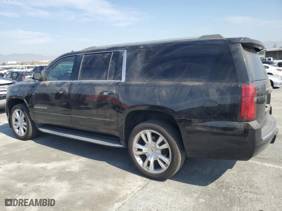 2017 Chevrolet Suburban Premier with VIN 1GNSCJKC0HR140111, listed as a Copart auction lot 74387664 with 104,094 mi miles and Salvage Title. Bid and sale history available at carsss.com. Image 2.