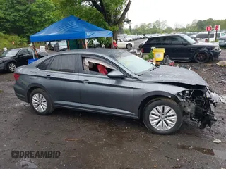 2019 Volkswagen Jetta S z VIN 3VWC57BU7KM232096, wystawiony jako IAAI lot #42317927 z przebiegiem 98 615 mil mil oraz . Historia ofert i sprzedaży dostępna na DreamBid. Obrazek 13.