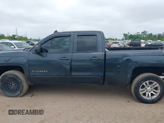 2018 Chevrolet Silverado 1500 LT with VIN 1GCRCREC9JZ105218, listed as a IAAI auction lot 40778682 with 124,621 mi miles and . Bid and sale history available at DreamBid. Image 14.