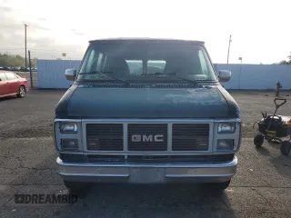 1991 GMC Vandura z VIN 1GDEG25K6M7504729, wystawiony jako Copart lot #71146614 z przebiegiem 181 800 mil mil oraz Tytuł czysty. Historia ofert i sprzedaży dostępna na DreamBid. Obrazek 5.