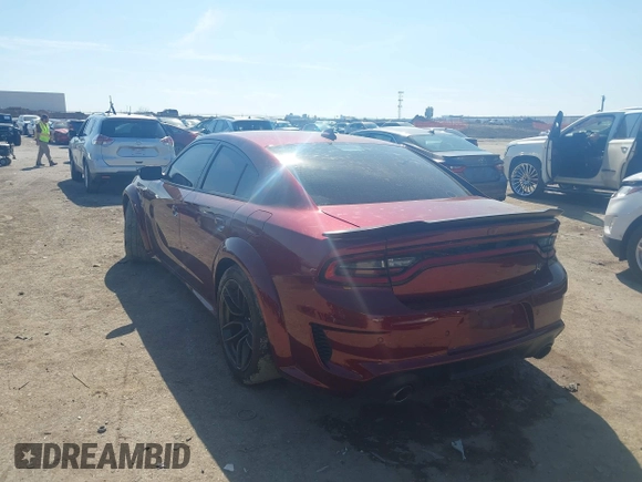 2022 Dodge Charger Scat Pack with VIN 2C3CDXGJ6NH216788, listed as a IAAI auction lot 41670744 with 48,680 mi miles and . Bid and sale history available at carsss.com. Image 3.
