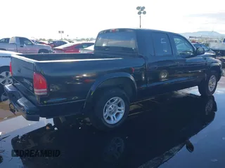 2003 Dodge Dakota Sport with VIN 1D7HL38X53S381338, listed as a IAAI auction lot 38840426 with 130,846 mi miles. Bid and sale history available at carsss.com. Image 4.
