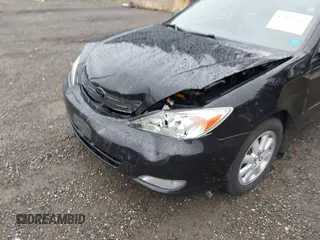 2003 Toyota Camry LE z VIN 4T1BF30KX3U049919, wystawiony jako IAAI lot #42148543 z przebiegiem 208 140 mil mil oraz . Historia ofert i sprzedaży dostępna na DreamBid. Obrazek 5.