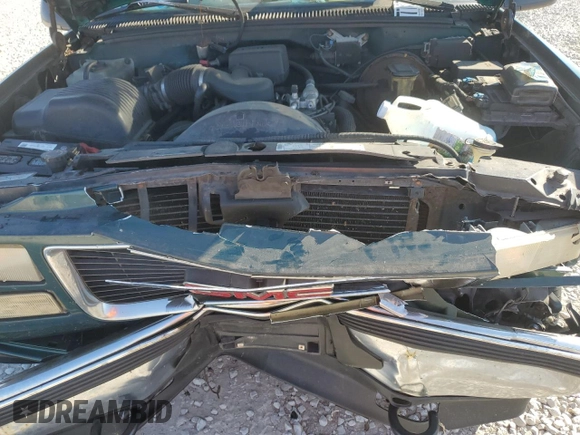 1997 GMC Suburban z VIN 3GKFK16R7VG514905, wystawiony jako Copart lot #77410934 z przebiegiem 193 116 mil mil oraz Szkoda całkowita • Salvage title. Historia ofert i sprzedaży dostępna na DreamBid. Obrazek 13.