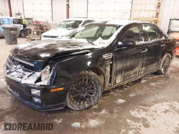 2010 Cadillac STS AWD with VIN 1G6DU6EV2A0125065, listed as a IAAI auction lot 41229886 with 84,954 mi miles and . Bid and sale history available at DreamBid. Image 2.