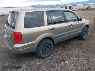 2004 Honda Pilot LX with VIN 2HKYF18144H501874, listed as a IAAI auction lot 41717956 with 290,828 mi miles. Bid and sale history available at carsss.com. Image 4.