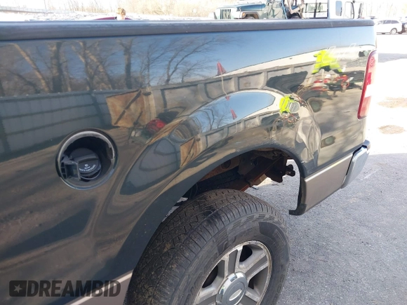 2005 Ford F-150 XLT with VIN 1FTPX14505FB72622, listed as a IAAI auction lot 41823532 with 165,918 mi miles. Bid and sale history available at carsss.com. Image 14.