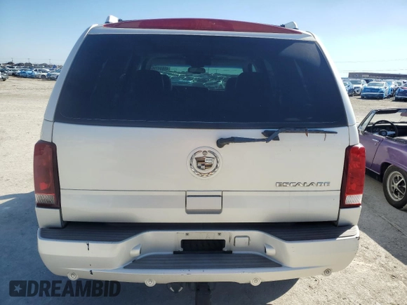 2003 Cadillac Escalade с VIN 1GYEC63T63R290034, выставлен на аукционе Copart как лот 46844735 с пробегом 304 433 миль миль и Чистый • Clean title. История ставок и продаж доступна на DreamBid. Изображение 6.