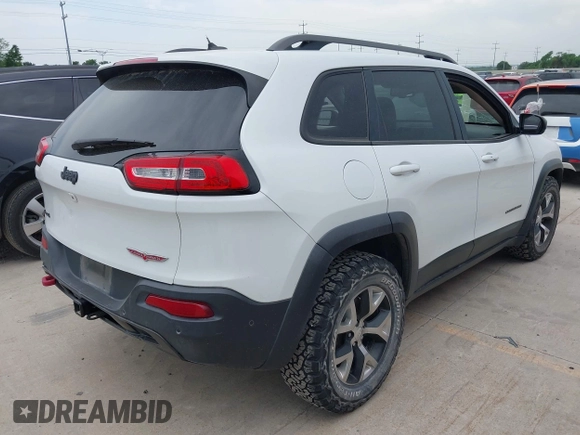 2015 Jeep Cherokee Trailhawk with VIN 1C4PJMBS9FW623740, listed as a IAAI auction lot 42131019 with 155,105 mi miles and . Bid and sale history available at DreamBid. Image 4.