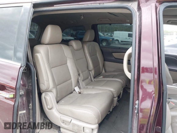 2014 Honda Odyssey Touring with VIN 5FNRL5H94EB127695, listed as a IAAI auction lot 41936109 with 221,786 mi miles and . Bid and sale history available at DreamBid. Image 8.