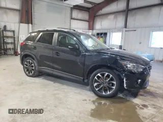 2016 Mazda CX-5 Grand Touring with VIN JM3KE4DY6G0655802, listed as a Copart auction lot 43820475 with 76,639 mi miles and Salvage Title. Bid and sale history available at carsss.com. Image 4.