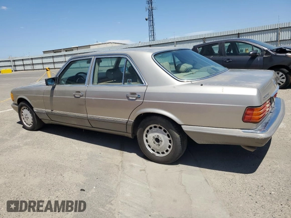1990 Mercedes-Benz 300 with VIN WDBCA24D1LA529716, listed as a Copart auction lot 56581335 with 122,286 mi miles and Salvage Title. Bid and sale history available at DreamBid. Image 2.