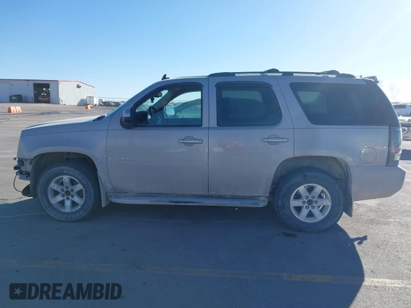 2009 GMC Yukon SLT w/4SA with VIN 1GKFK33039J117245, listed as a IAAI auction lot 41421302 with 199,864 mi miles. Bid and sale history available at carsss.com. Image 14.