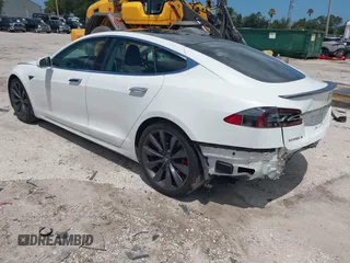 2017 Tesla Model S 100D with VIN 5YJSA1E45HF189006, listed as a IAAI auction lot 42540693 with 64,827 mi miles and . Bid and sale history available at DreamBid. Image 3.