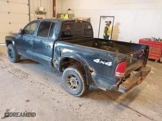 2003 Dodge Dakota Sport with VIN 1D7HG38N03S144856, listed as a IAAI auction lot 41842049 with 162,788 mi miles. Bid and sale history available at carsss.com. Image 3.