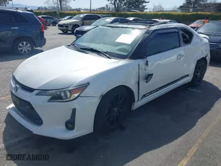 2015 Scion tC with VIN JTKJF5C71F3095189, listed as a IAAI auction lot 41847417 with 129,164 mi miles. Bid and sale history available at carsss.com. Image 2.
