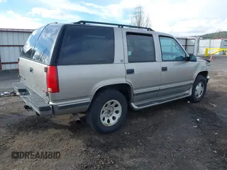 1999 GMC Yukon with VIN 1GKEK13R2XJ712390, listed as a IAAI auction lot 41793649 with 222,721 mi miles. Bid and sale history available at carsss.com. Image 4.