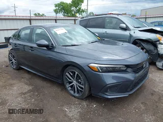 2024 Honda Civic Touring z VIN 2HGFE1F98RH304906, wystawiony jako IAAI lot #42217308 z przebiegiem 22 829 mil mil oraz . Historia ofert i sprzedaży dostępna na DreamBid. Obrazek 1.