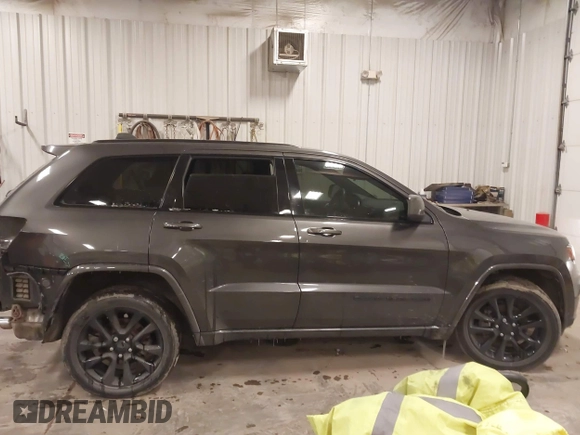 2018 Jeep Grand Cherokee Laredo E with VIN 1C4RJFAG6JC499261, listed as a IAAI auction lot 41033418 with 67,554 mi miles and . Bid and sale history available at DreamBid. Image 13.