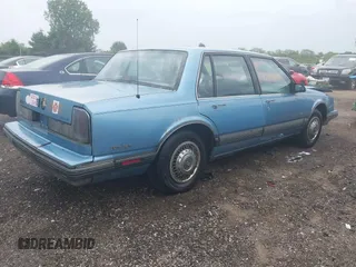 1991 Oldsmobile Delta z VIN 1G3HN54C6M1809377, wystawiony jako IAAI lot #42275221 z przebiegiem 139 509 mil mil oraz . Historia ofert i sprzedaży dostępna na DreamBid. Obrazek 4.