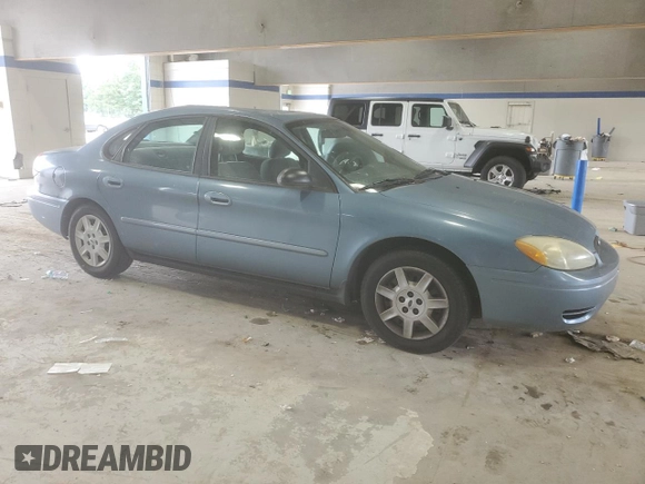 2007 Ford Taurus SE with VIN 1FAFP53U17A215432, listed as a Copart auction lot 64029215 with 121,190 mi miles and Salvage title. Bid and sale history available at DreamBid. Image 4.