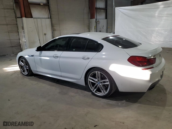 2015 BMW 6 Series 650i xDrive with VIN WBA6B4C56FD761374, listed as a Copart auction lot 41599334 with 63,057 mi miles and Salvage Title. Bid and sale history available at carsss.com. Image 2.
