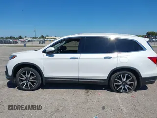 2022 Honda Pilot Touring 7-Passenger с VIN 5FNYF5H66NB034248, выставлен на аукционе IAAI как лот 41777362 с пробегом 26 611 миль миль и . История ставок и продаж доступна на DreamBid. Изображение 13.