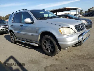 2000 Mercedes-Benz M-Class with VIN 4JGAB72E2YA185234, listed as a Copart auction lot 83479684 with 209,491 mi miles and Clean Title. Bid and sale history available at carsss.com. Image 4.