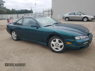 1998 Nissan 240SX z VIN JN1AS44D9WW105258, wystawiony jako Copart lot #71475754 z przebiegiem 363 254 mil mil oraz Szkody całkowita. Historia ofert i sprzedaży dostępna na DreamBid. Obrazek 4.