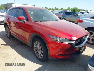 2021 Mazda CX-5 Grand Touring with VIN JM3KFADM4M0476615, listed as a IAAI auction lot 42004814 with 42,483 mi miles. Bid and sale history available at carsss.com. Image 1.