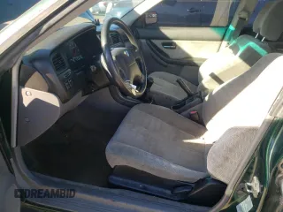 2000 Subaru Legacy L with VIN 4S3BE6352Y6214274, listed as a Copart auction lot 77827604 with 117,520 mi miles and Salvage title. Bid and sale history available at DreamBid. Image 7.