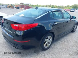 2015 Kia Optima LX z VIN KNAGM4A77F5651513, wystawiony jako IAAI lot #42385705 z przebiegiem 144 111 mil mil oraz . Historia ofert i sprzedaży dostępna na DreamBid. Obrazek 4.