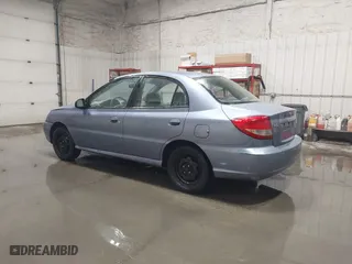 2003 Kia Rio with VIN KNADC125536274171, listed as a IAAI auction lot 41986369 with 59,837 mi miles. Bid and sale history available at carsss.com. Image 3.