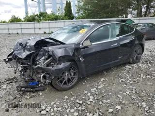 2020 Tesla Model 3 Long Range z VIN 5YJ3E1EB6LF741385, wystawiony jako Copart lot #58149495 z przebiegiem Nie podano mil oraz Szkoda całkowita • Salvage title. Historia ofert i sprzedaży dostępna na DreamBid. Obrazek 1.
