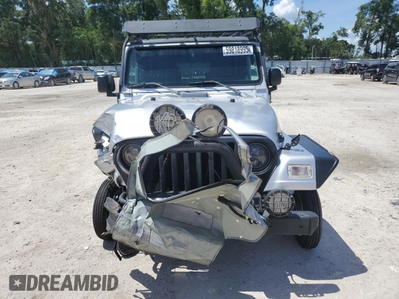 2005 Jeep Wrangler Sport z VIN 1J4FA49S75P324462, wystawiony jako Copart lot #59818995 z przebiegiem 183 558 mil mil oraz Nie do naprawy • Non repairable. Historia ofert i sprzedaży dostępna na DreamBid. Obrazek 5.