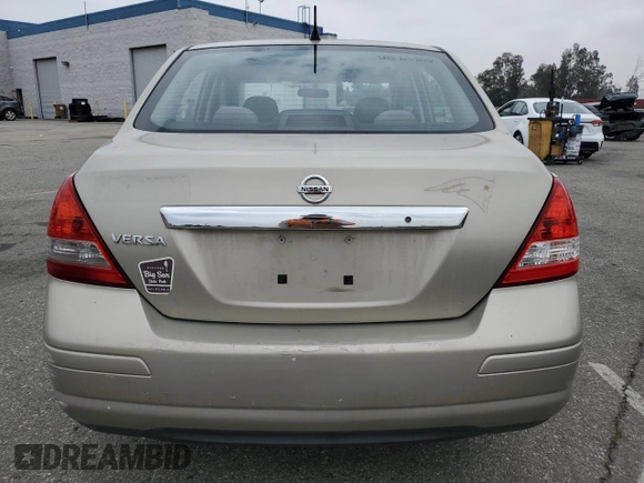 2009 Nissan Versa S with VIN 3N1BC11E79L433933, listed as a Copart auction lot 54953675 with 196,785 mi miles and Salvage Title. Bid and sale history available at DreamBid. Image 6.